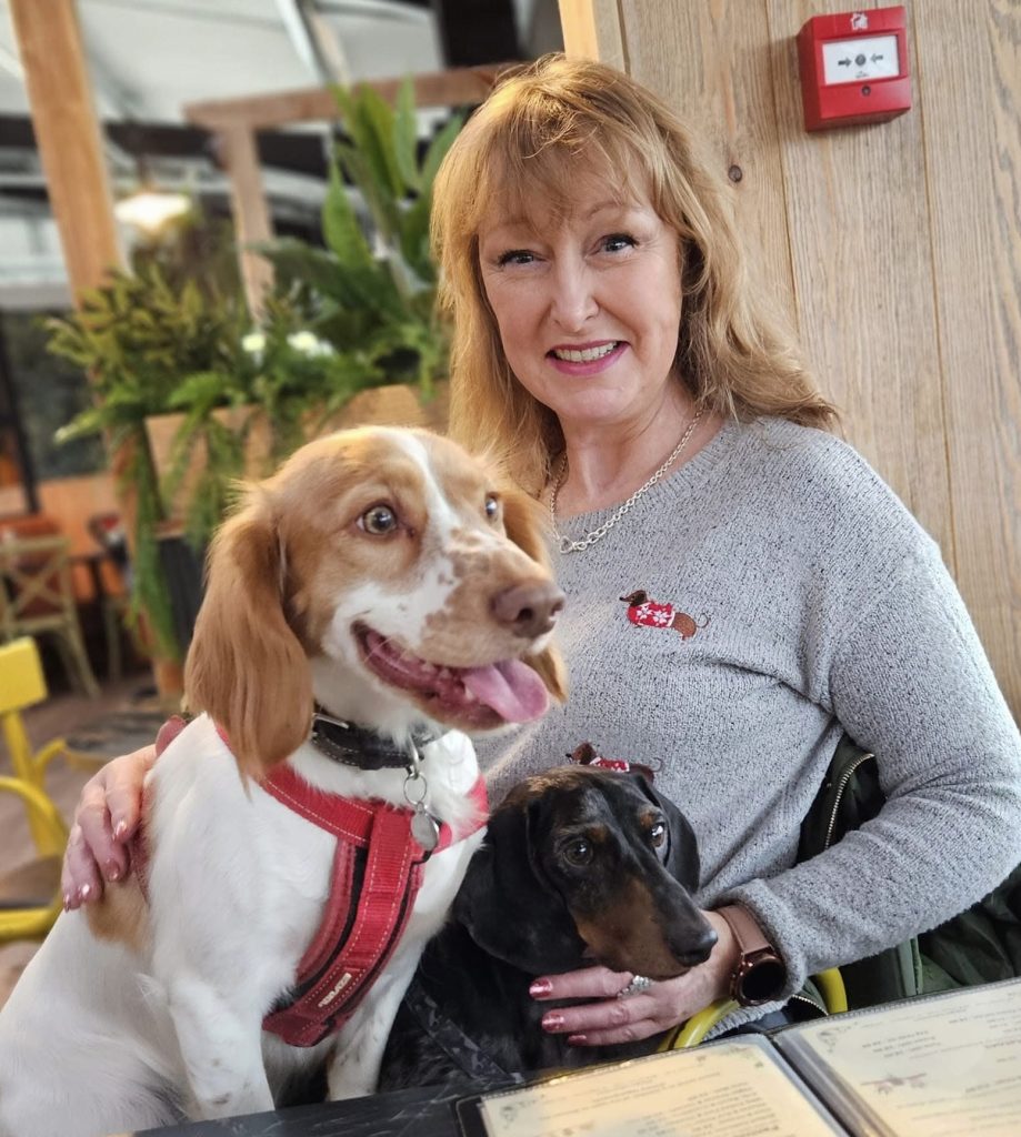 Informal photo of Jayne. Founder of Best With Jayne, with her dogs.